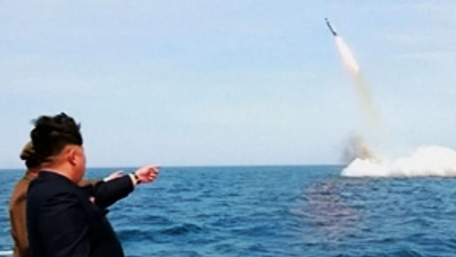 Image: Missile tests add pressure on Trump over North Korea