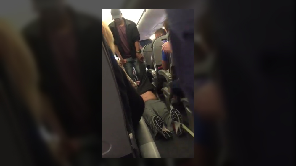Image: United Airlines drags physician kicking and screaming off a flight he PAID FOR because they overbooked and wanted the seat back