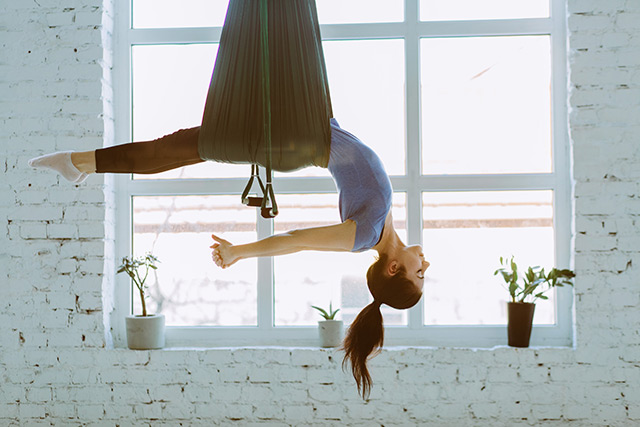 Image: A different perspective: Why getting upside down with aerial yoga is so good for your body