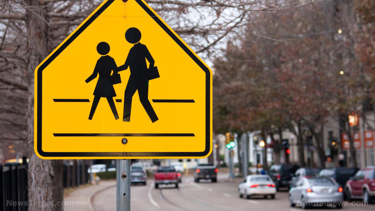 Image: VIDEO: Students sign petition to ban ‘offensive’ white man in crosswalk signs