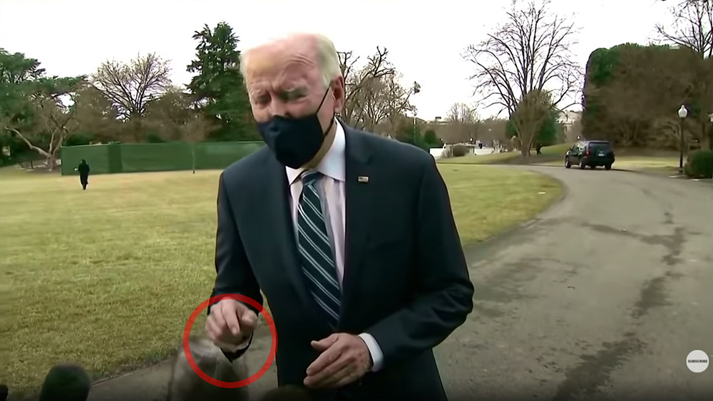 <div>FAKE CGI Biden caught moving hand through reporter's camera gear even though his image was standing several feet away</div>