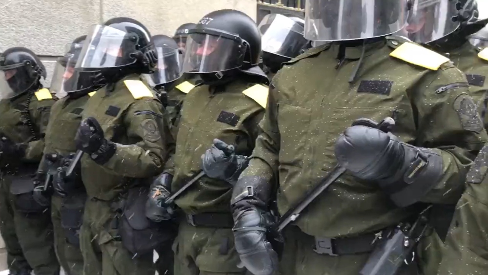 Image: Tyranny spreads in Canada as police now cover names, badge numbers on uniforms to evade identification as they brutally assault peaceful protesters