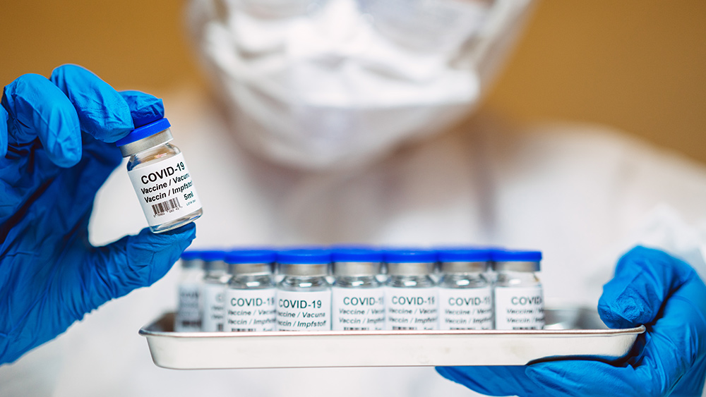 Lab-Tech-Vaccine-Vials-Covid-19.jpg