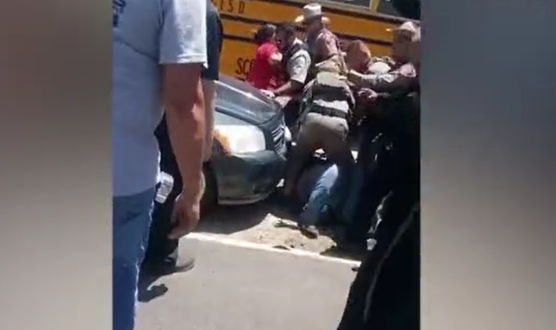 Image: OUTRAGE: Mother of two who came to Uvalde school was handcuffed after demanding police stop standing around and do something